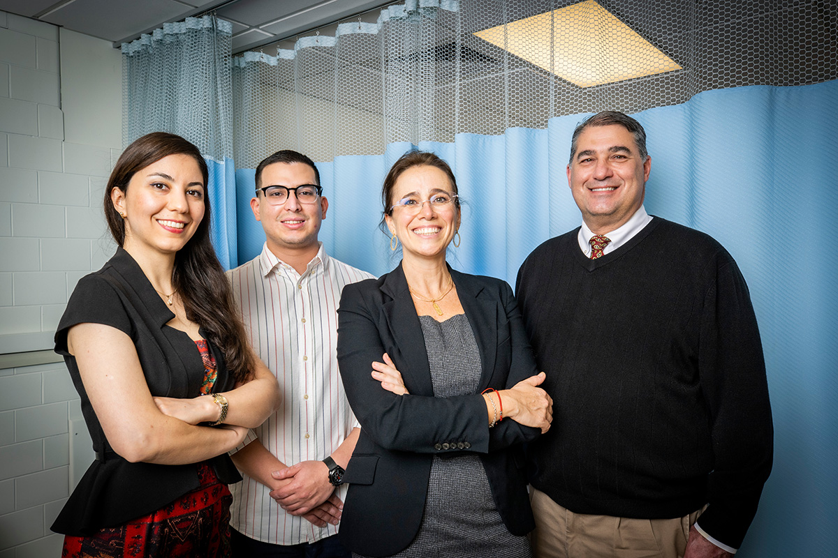  Research by scientists at the University of Illinois Urbana-Champaign identifies the stomach, not the liver, as the site of alcohol first-pass metabolism in women who underwent sleeve gastrectomy surgery. The team, from left, postdoctoral fellow and first author Neda Seyedsadjadi; graduate student Raul Alfaro Leiva; M. Yanina Pepino, professor of food science and human nutrition; and Dr. Blair Rowitz, professor of nutritional sciences and the associate dean for clinical affairs at the Carle Illinois College of Medicine.