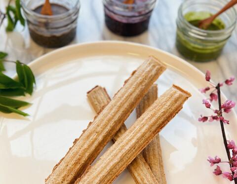 Churroats with dipping sauces.
