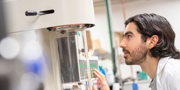Student working with lab equipment