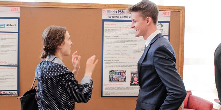 PSM student chatting with instructor.
