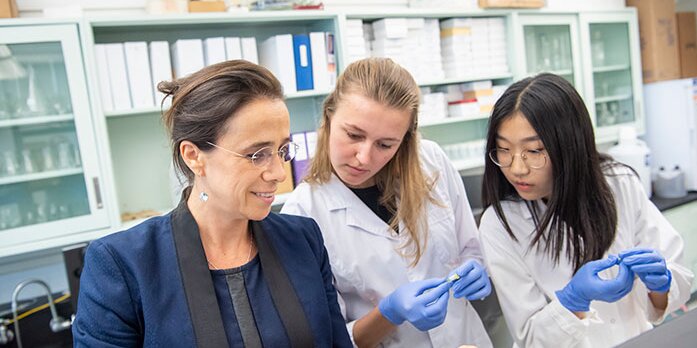 Students in lab with professor.