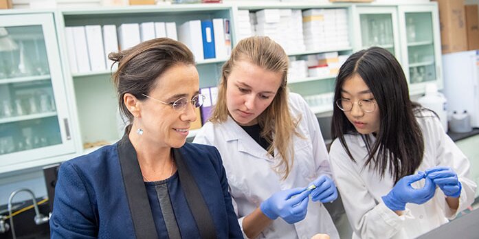 Students and professor in lab.