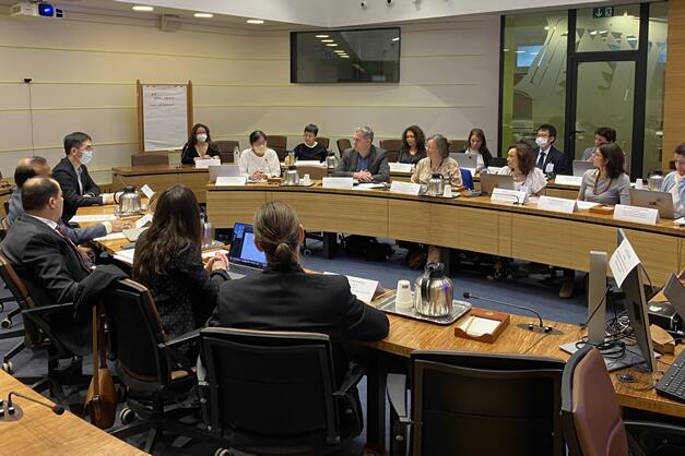 People sitting around a board room table