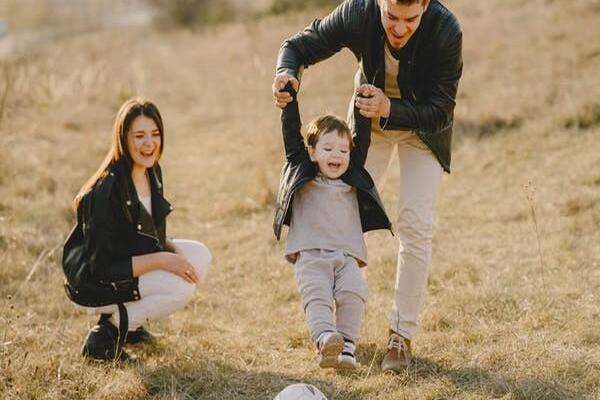 Family playing soccer