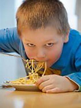 child eating noodles.